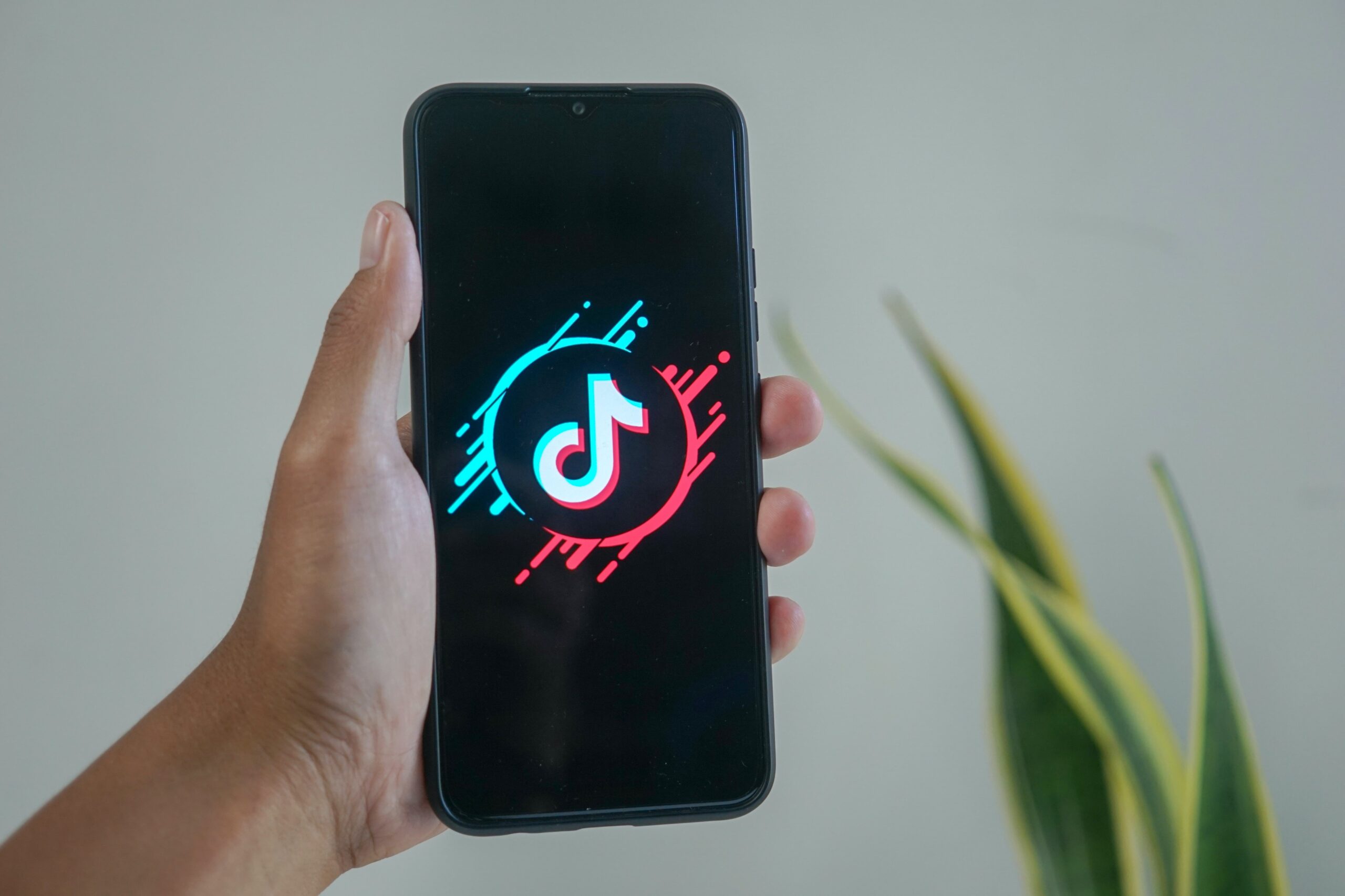 person-holding-phone-with-tiktok-logo-on-the-screen