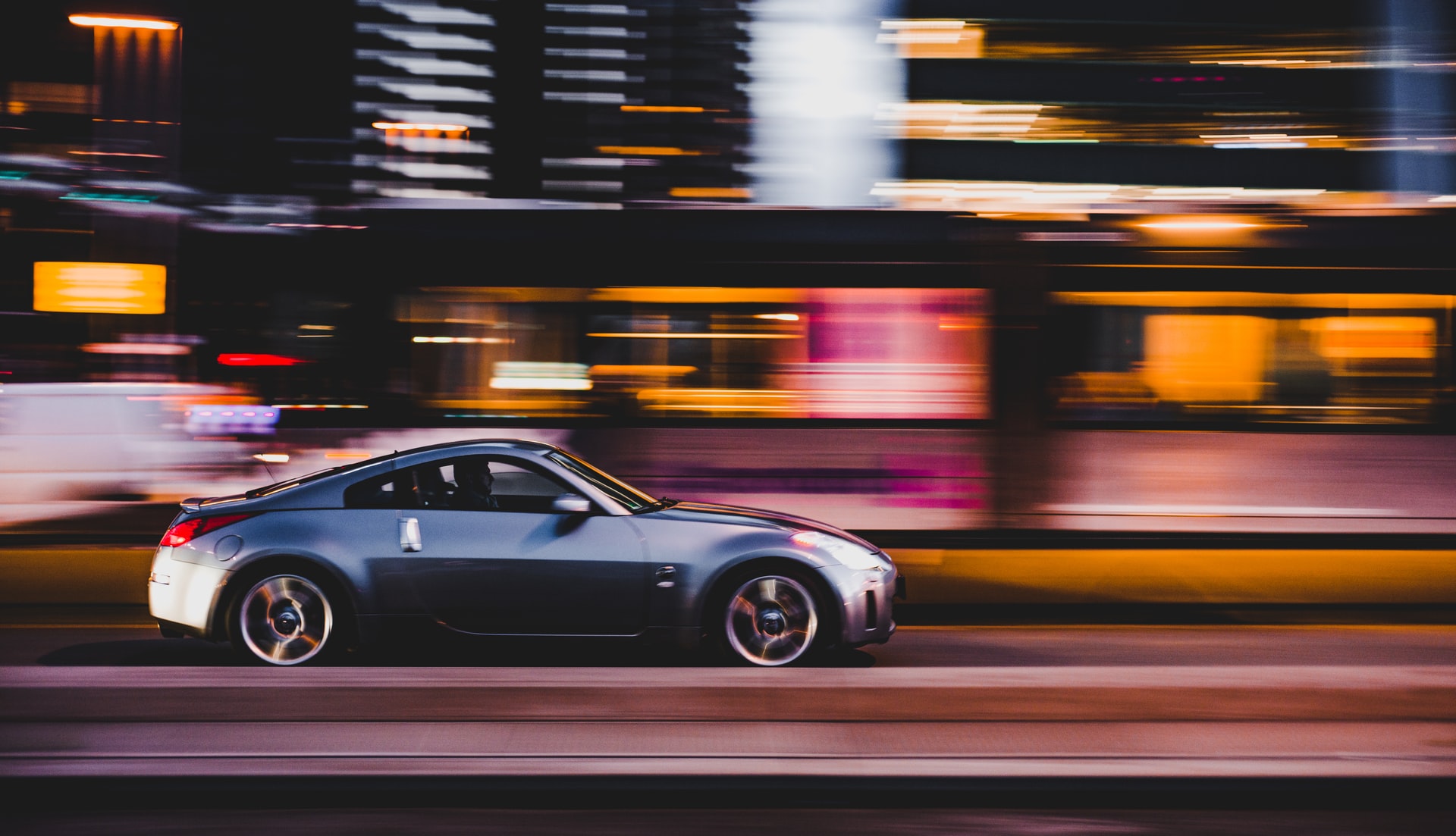 fast-car-driving-through-city-at-night
