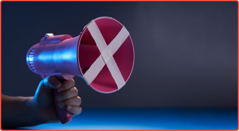 Red megaphone with cross through 