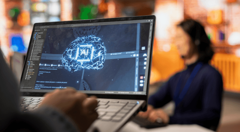 Person accessing AI marketing software through a laptop computer.